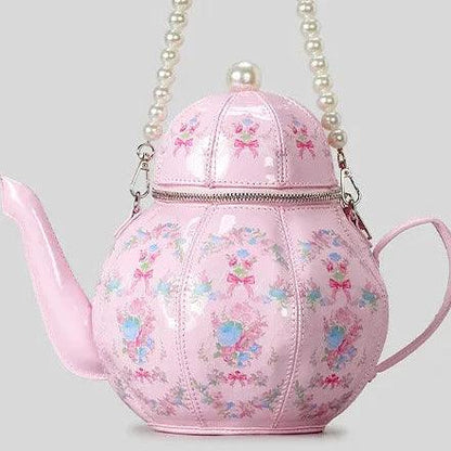Pink teapot-shaped mini bag with pearl beaded strap and bow-and-flower print