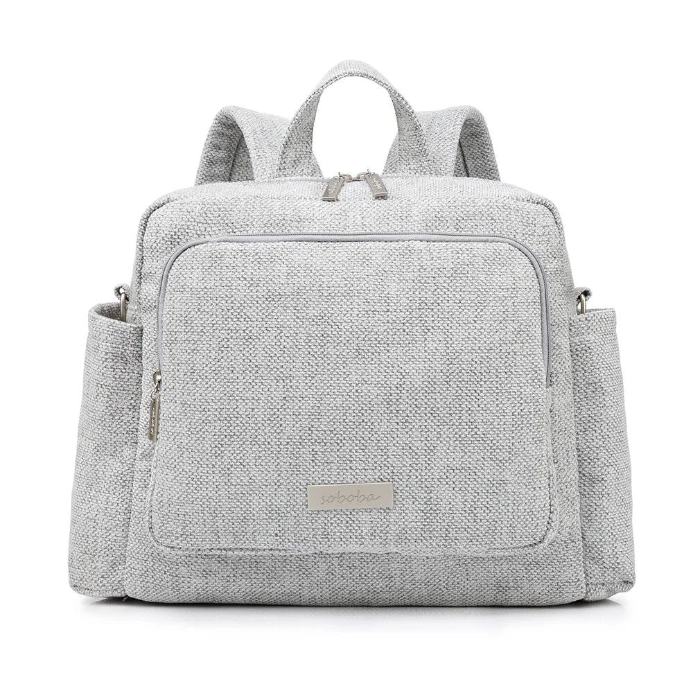 Gray waterproof diaper bag backpack with front zip pocket and top carry handles