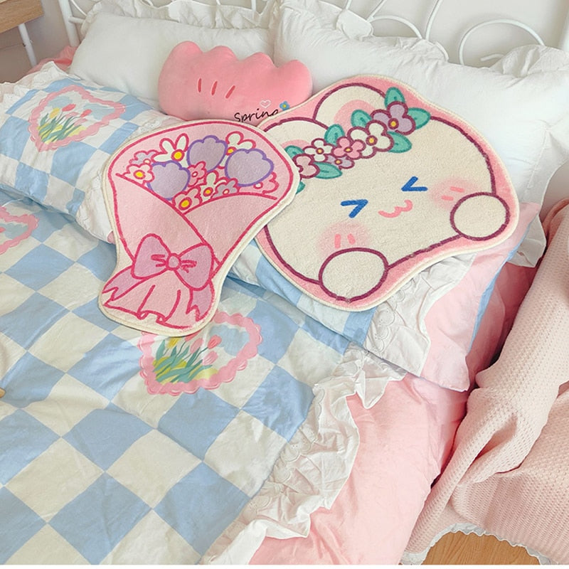 Cute oval floor mat rug with pink bear face, rainbow and floral details