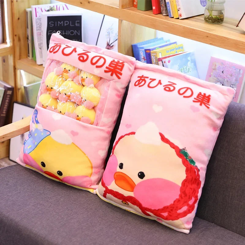 Pair of pink duck plush pillows with duck face and a small pile of duck plushies