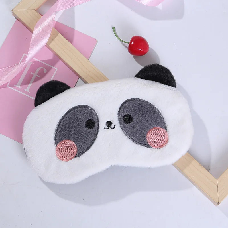Panda plush sleep mask with white and gray faces, pink cheeks, and cute stitched eyes