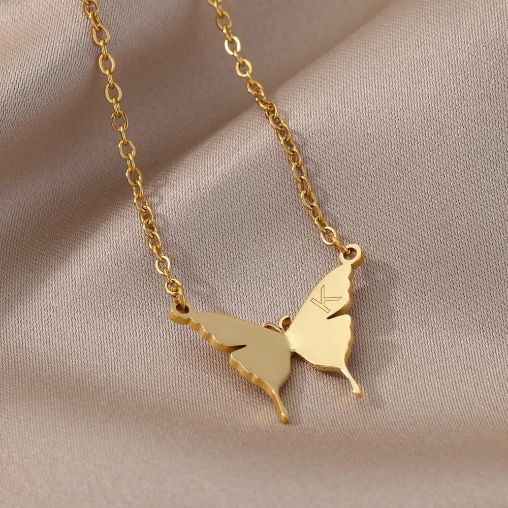 Butterfly pendant necklace with letter K, gold-tone chain