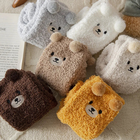 Assorted thick plush socks with bear faces in gray, white, beige, brown, and yellow.