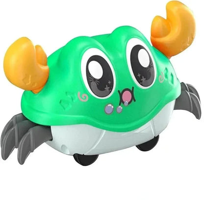 Green interactive crawling crab toy with orange claws, gray feet, and large cartoon eyes