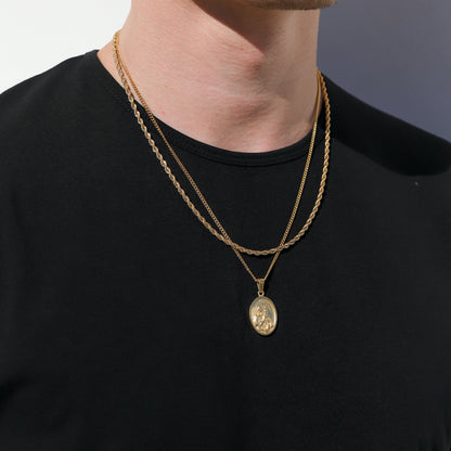 Layered gold chain necklaces with small round charm and oval pendant