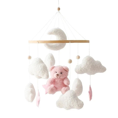 Pink plush and white cloud baby crib mobile with dangling animal and star shapes
