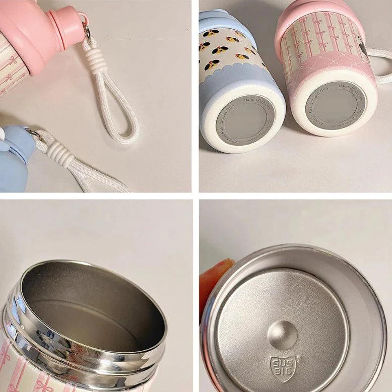 Pink thermos bottle base and lid, showing stainless interior and attached strap