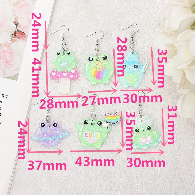 Frog acrylic earrings color chart on display card showing multiple frog styles and silver hooks
