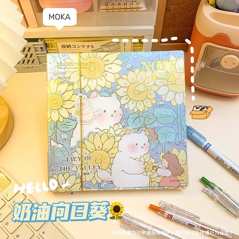 Light yellow illustrated notebook cover with daisies, rabbits, and a pocket-sized character