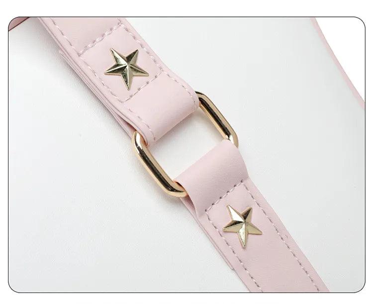 Kawaii messenger bag strap close-up with pink leatherette, gold star studs, and metal ring