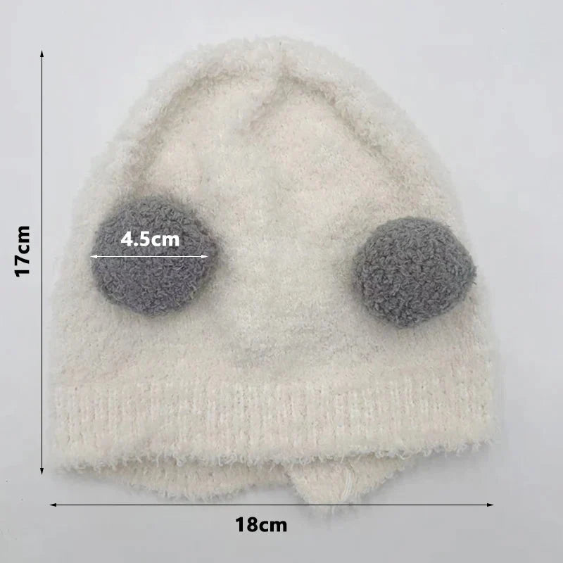 Kids ear protection hood hat in light beige with pom-pom ears, size shown