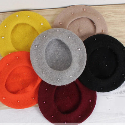 Assorted felt berets (yellow, pink, orange, gray, black, burgundy) with faux pearls