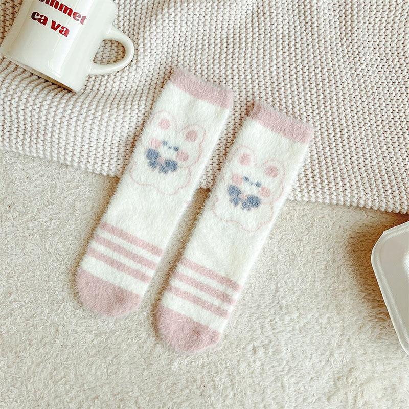 Bunny socks in white with blue paw prints and pink stripes at the toe area.
