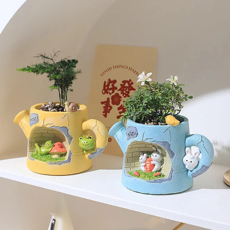 Resin watering can planters set: yellow and blue with tiny animal garden details