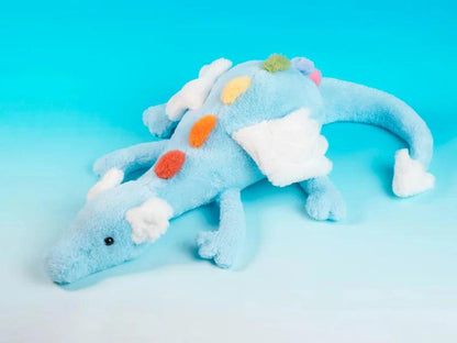 Rainbow dragon plush toy side view, light blue plush with white cloud patches and orange dots
