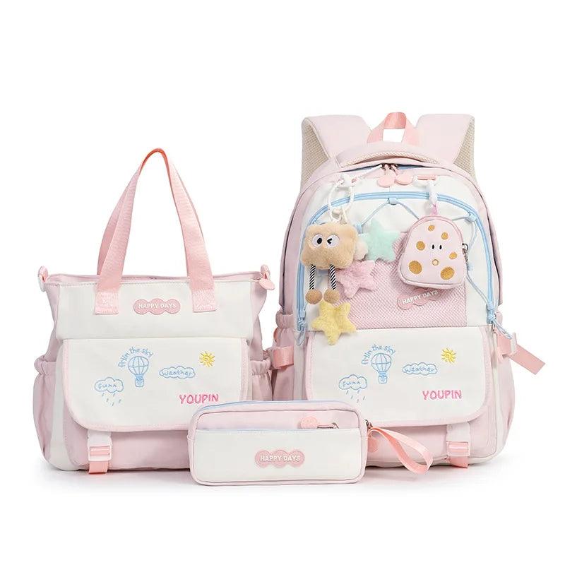 Pink kids backpack set with plush charm, front pocket, and matching small zip pouch
