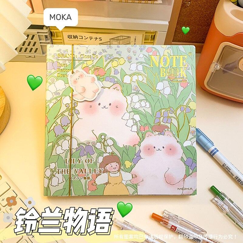 Green illustrated notebook cover with flowers and cute rabbits resting on the page