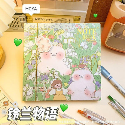 Green illustrated notebook cover with flowers and cute rabbits resting on the page
