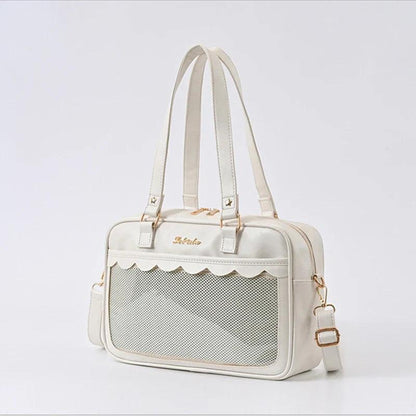 White Ita messenger bag with mesh-texture panel, scalloped top, double handles