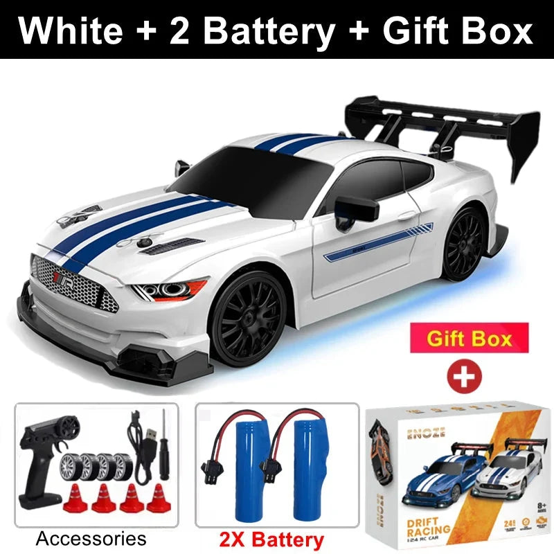 White 4WD RC drift car with blue racing stripe decals, black wheels and front bumper