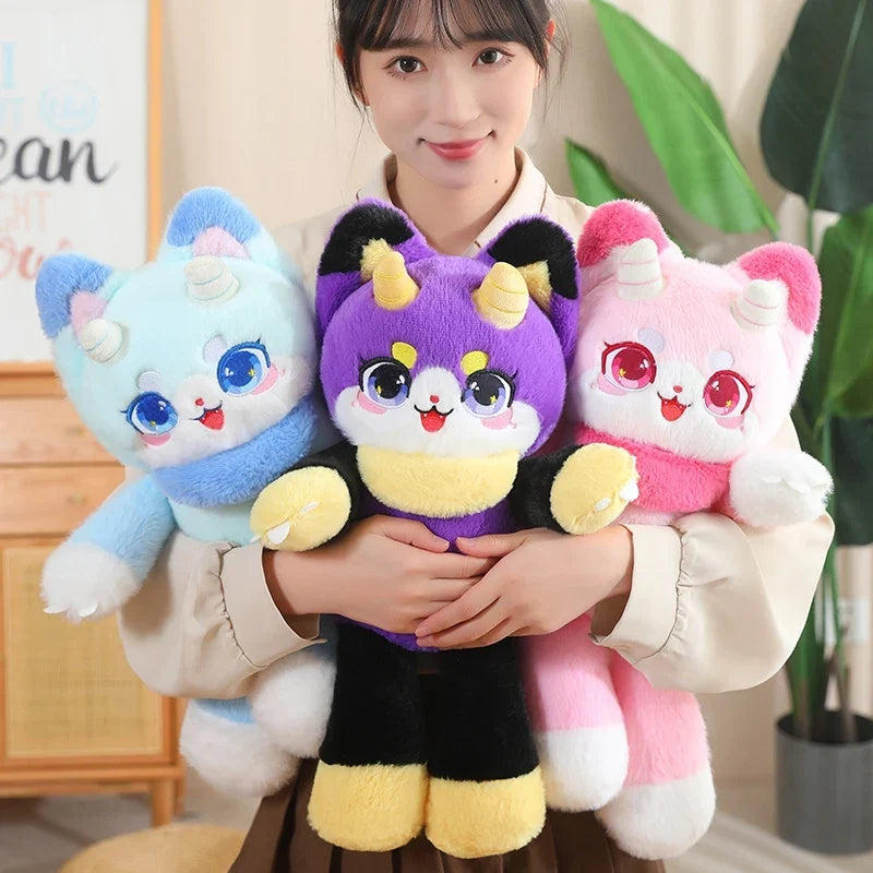 Three dragon cat plush toys held together: light blue, purple, and pink, cute faces