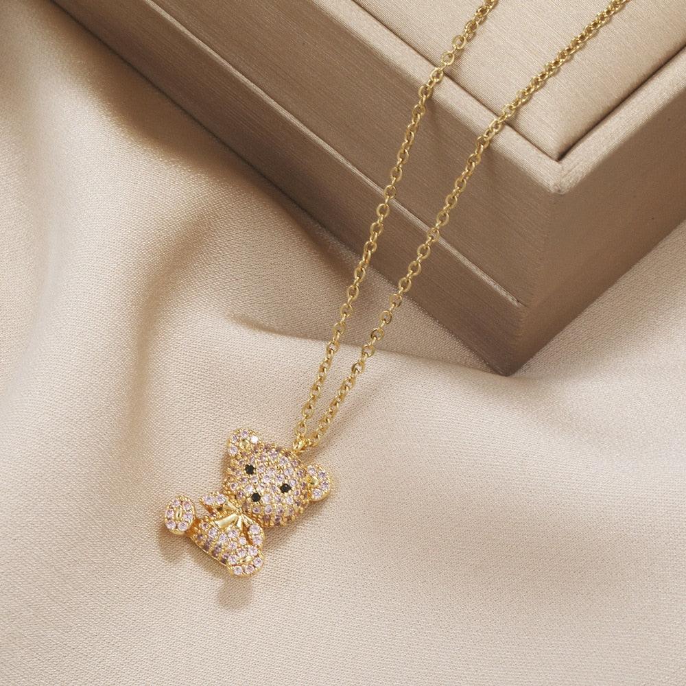 Teddy bear pendant necklace with gold-toned chain and glitter teddy bear pendant