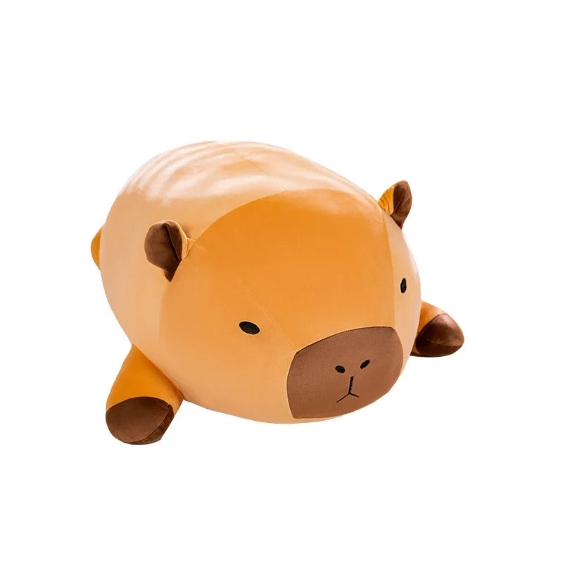 Orange capybara plush pillow with brown snout and side ears on white