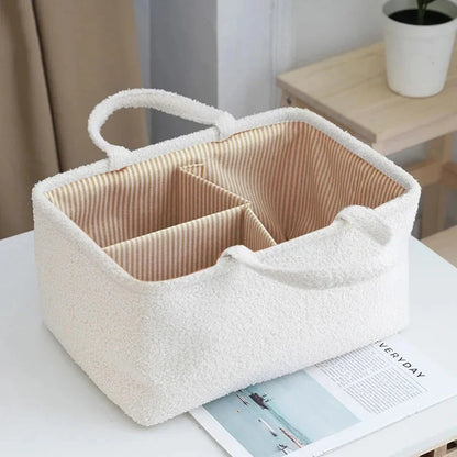 White diaper caddy organizer bag with striped inner lining and three separated sections