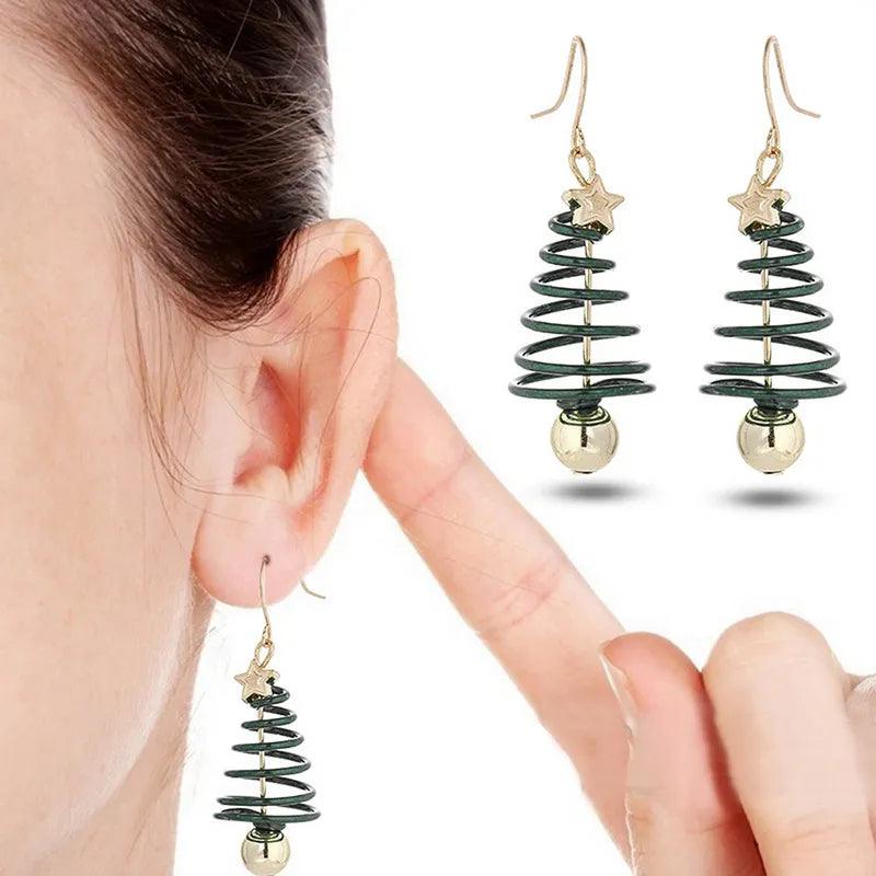 Gold drop earrings with green spiral tree charms, gold star tops and round beads