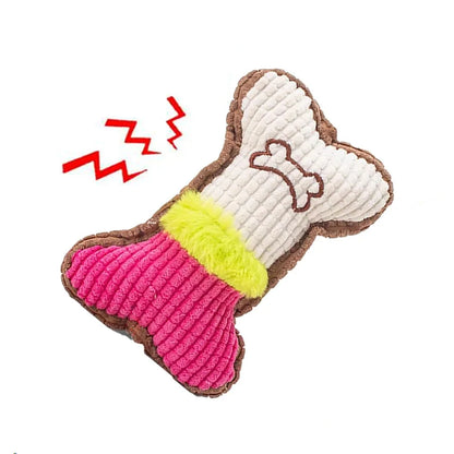 Plush squeaky bone toy, white and pink sections with green center, brown edges.
