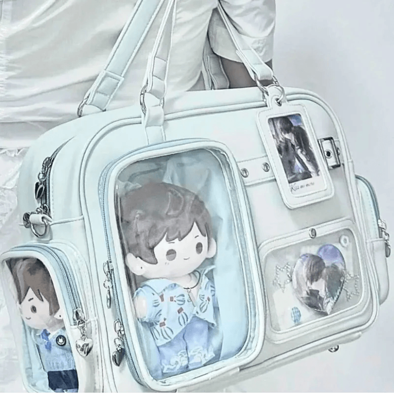 Pastel crossbody bag, light blue, front clear window pocket with character plush