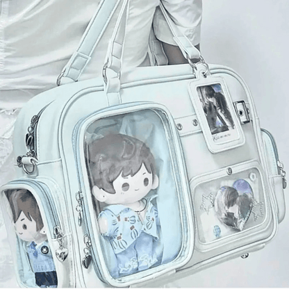Pastel crossbody bag, light blue, front clear window pocket with character plush