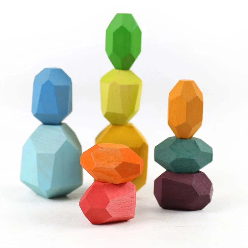 Wooden stacking rocks toy with three faceted wooden stacks in bright colors