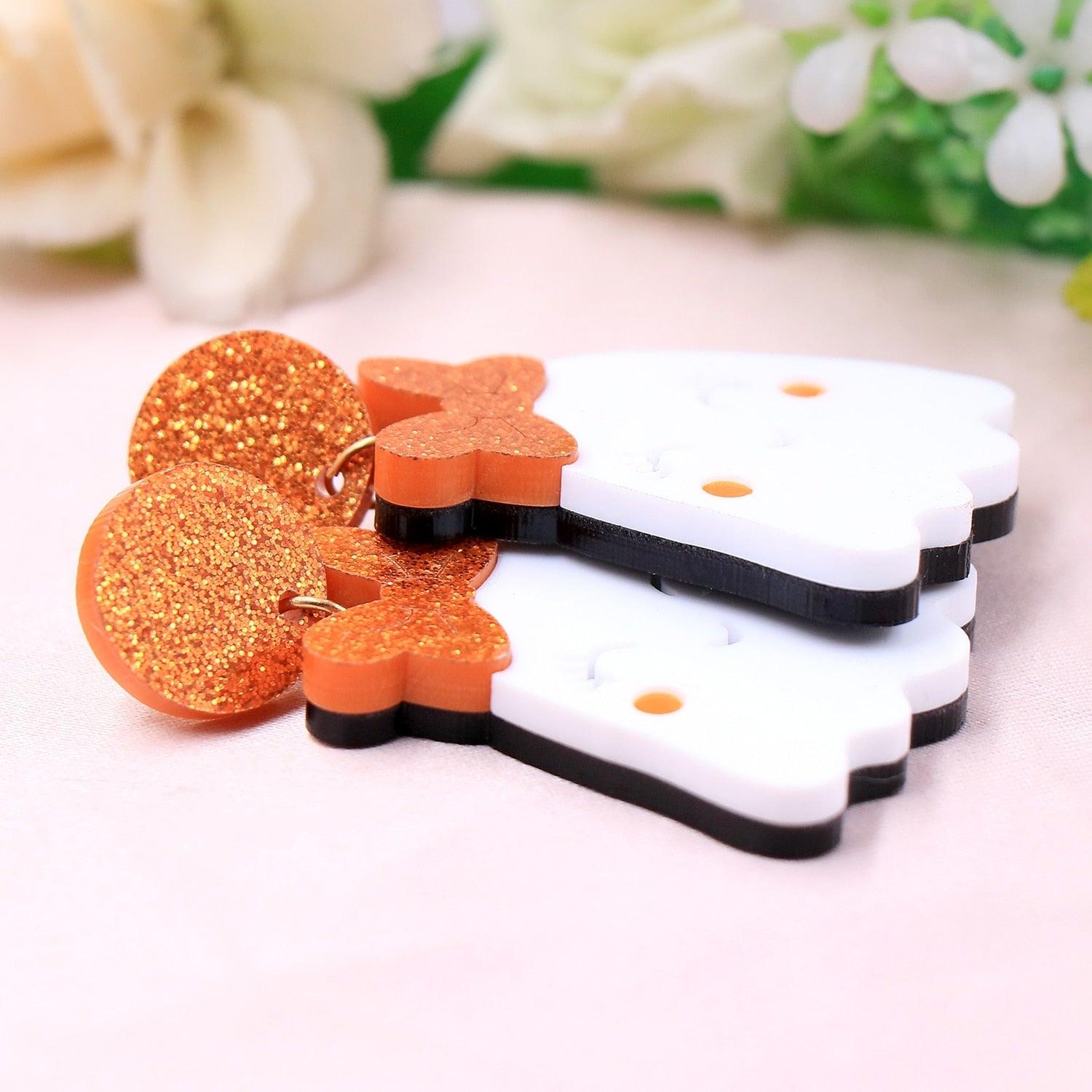 Halloween ghost earrings showing back and front; white ghost with orange glitter bow and crown