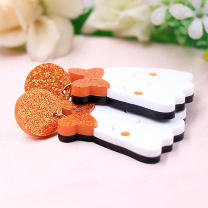 Halloween ghost earrings showing back and front; white ghost with orange glitter bow and crown