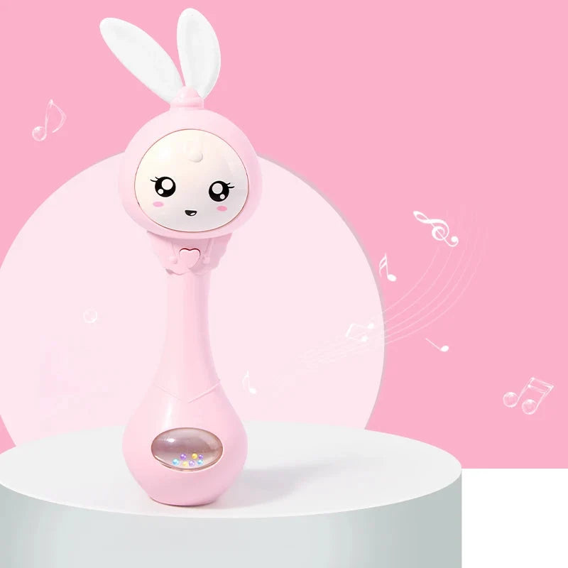 Pink rabbit baby rattle toy standing with bunny ears and light window