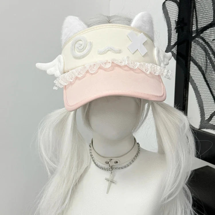 Pink cat-ear visor with lace trim and white confused kitty patch
