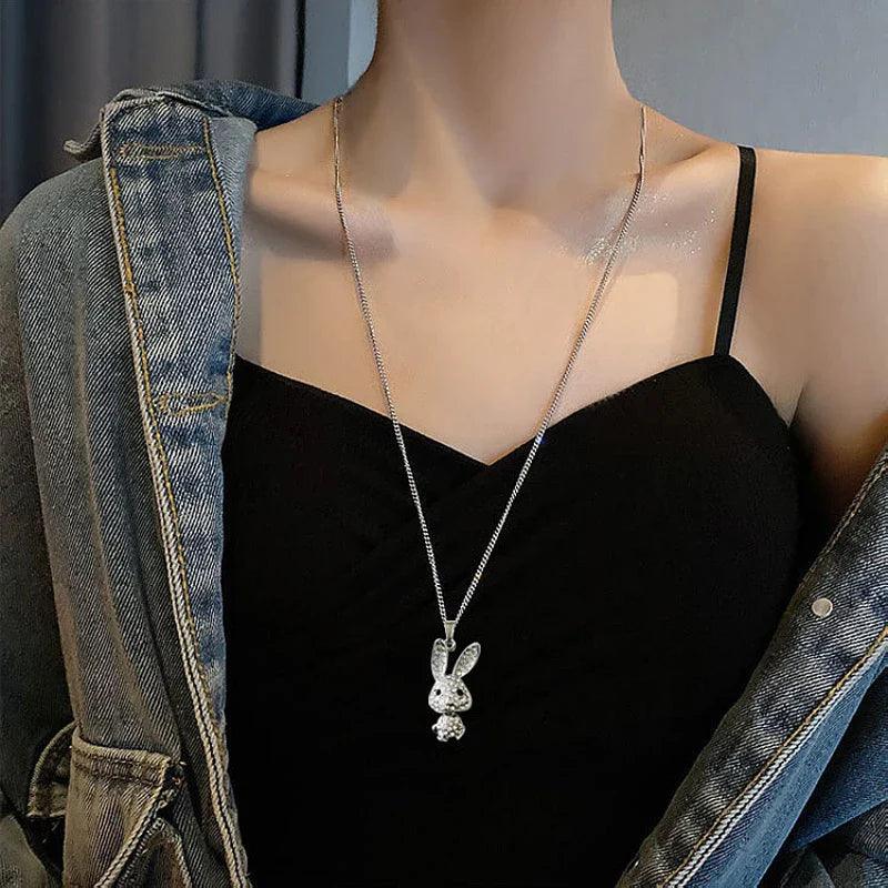 Rhinestone bunny pendant necklace worn at the chest with rabbit head charm