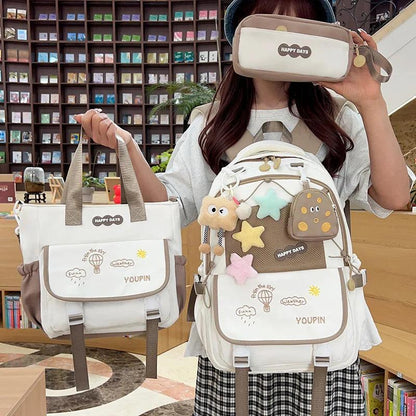 Beige/tan 3-piece backpack set with character artwork on front pockets and straps