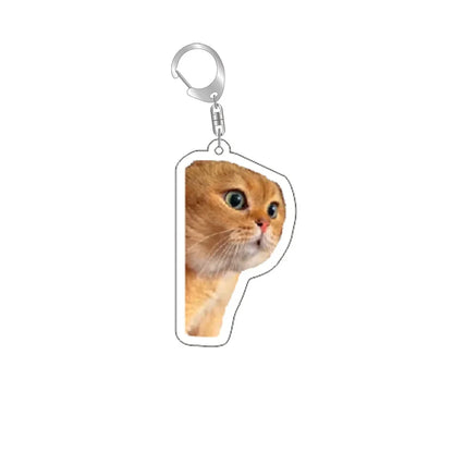 Cat keychain with silver ring and clip; orange kitten peeking to the side.