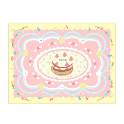 Pastel yellow plush area rug with central cake, rainbow swirls, and small animal faces