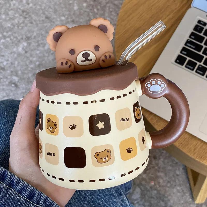 Teddy bear mug with lid and straw, brown-and-cream design with scattered paw and star icons
