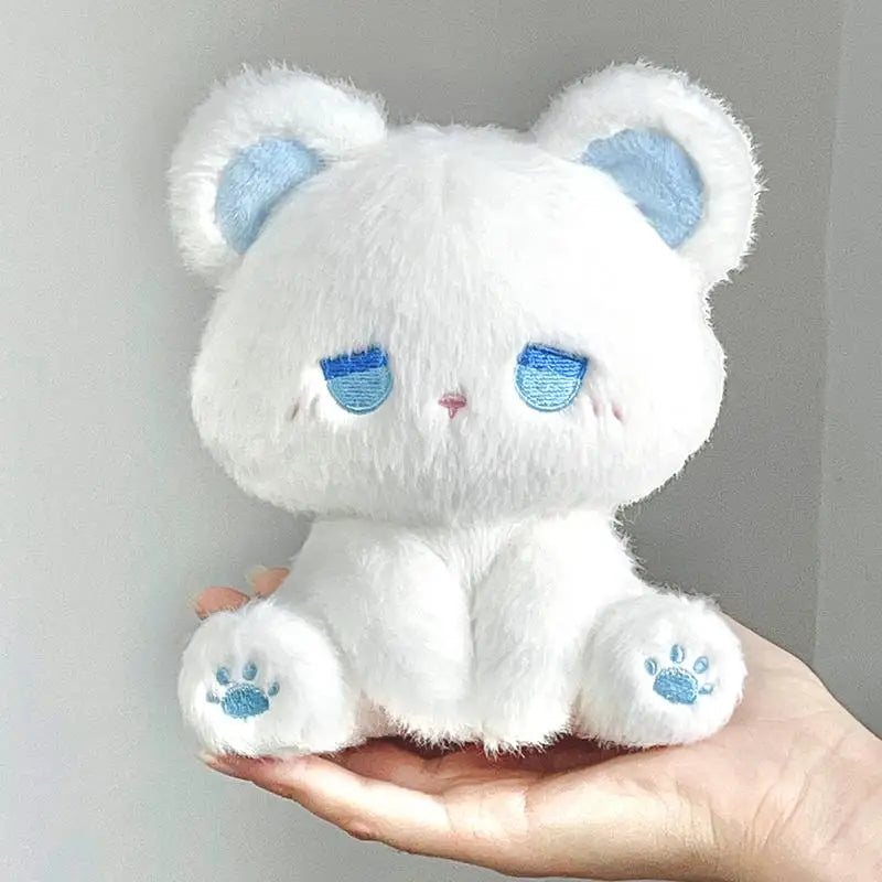White plush cat with blue sleepy face and paw prints, soft stuffed toy