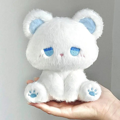White plush cat with blue sleepy face and paw prints, soft stuffed toy
