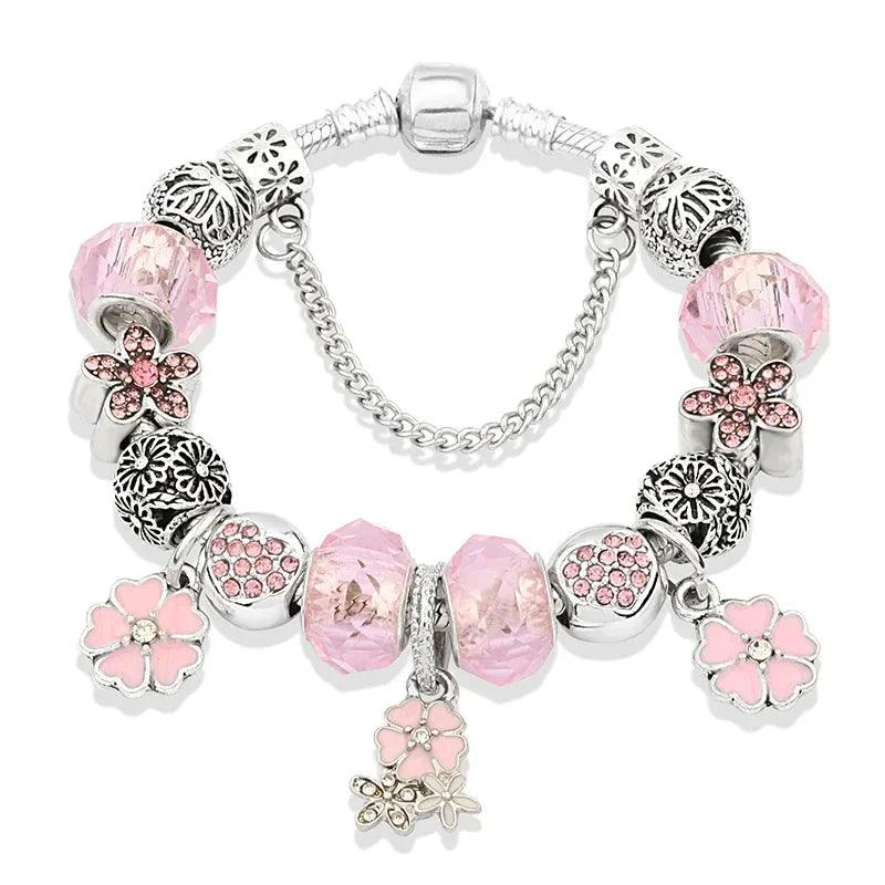 Pink charm bracelet with silver-tone beads, pink glass charms and flower dangles, clasp