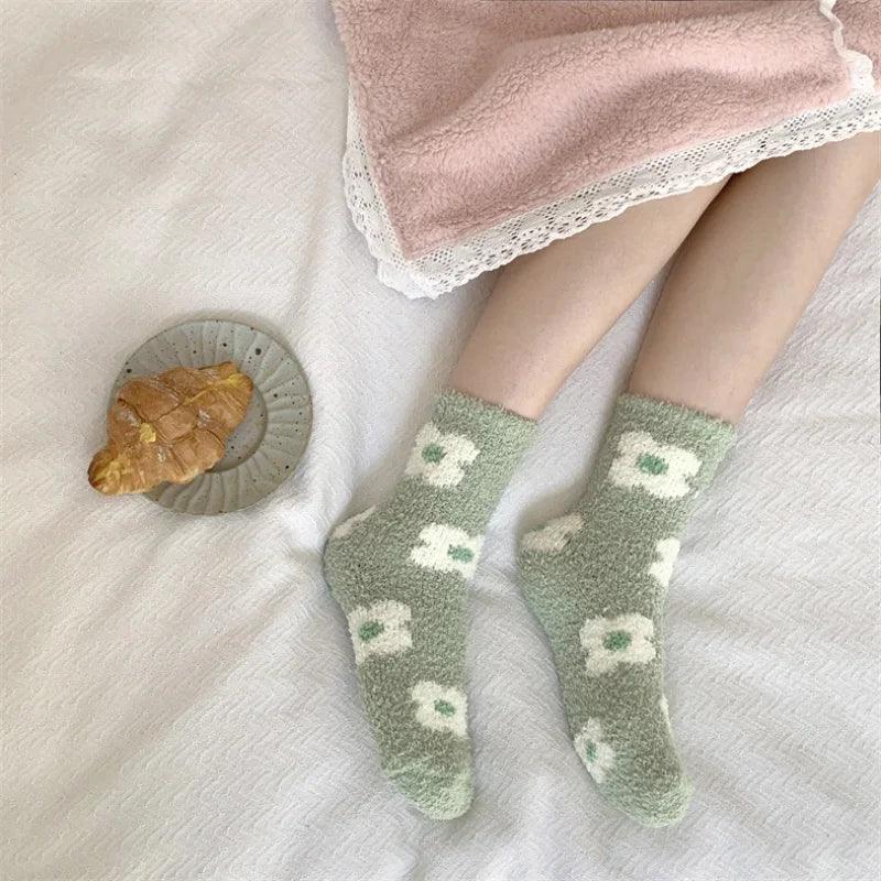 Soft plush sleeping socks, sage green with white floral paw-print style accents