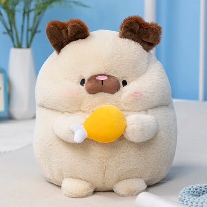 Cream puppy plush with brown ears and yellow ball on its belly, sitting.