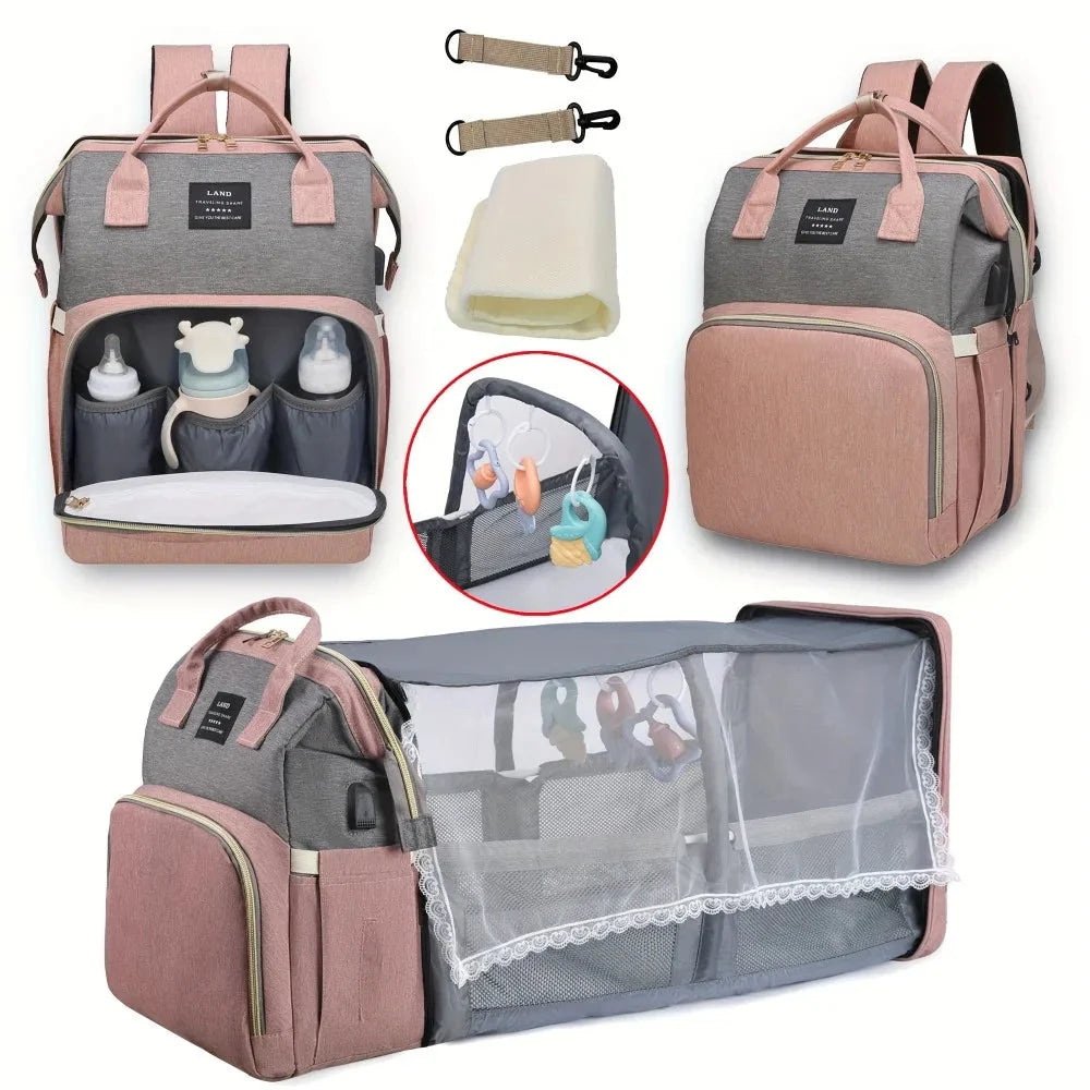 Pink and gray diaper backpack with open compartments and clear mesh front pocket