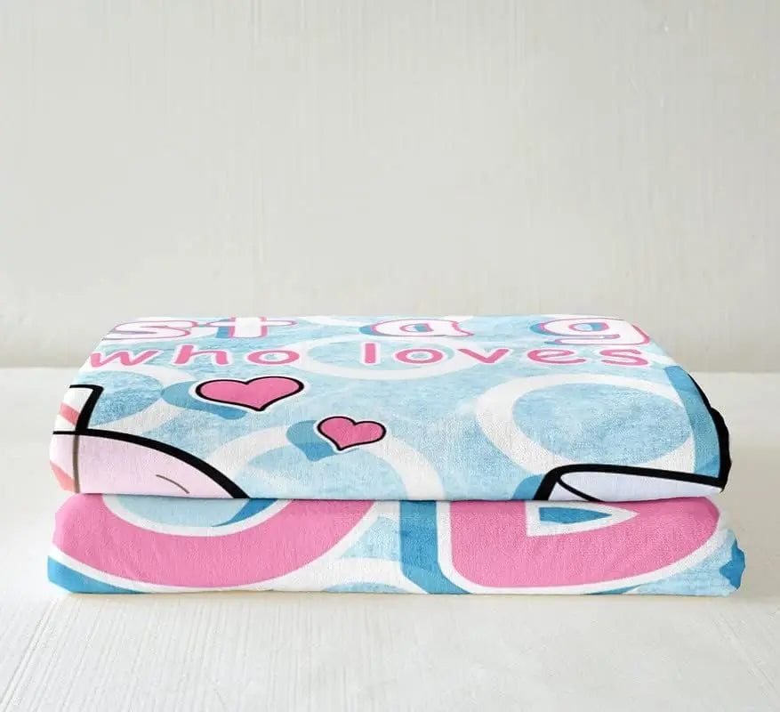 Boba tea fleece blanket folded with blue drink graphic, hearts, and pink text