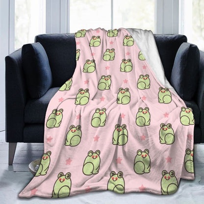 Flannel frog blanket in light pink with green cartoon frogs and star accents